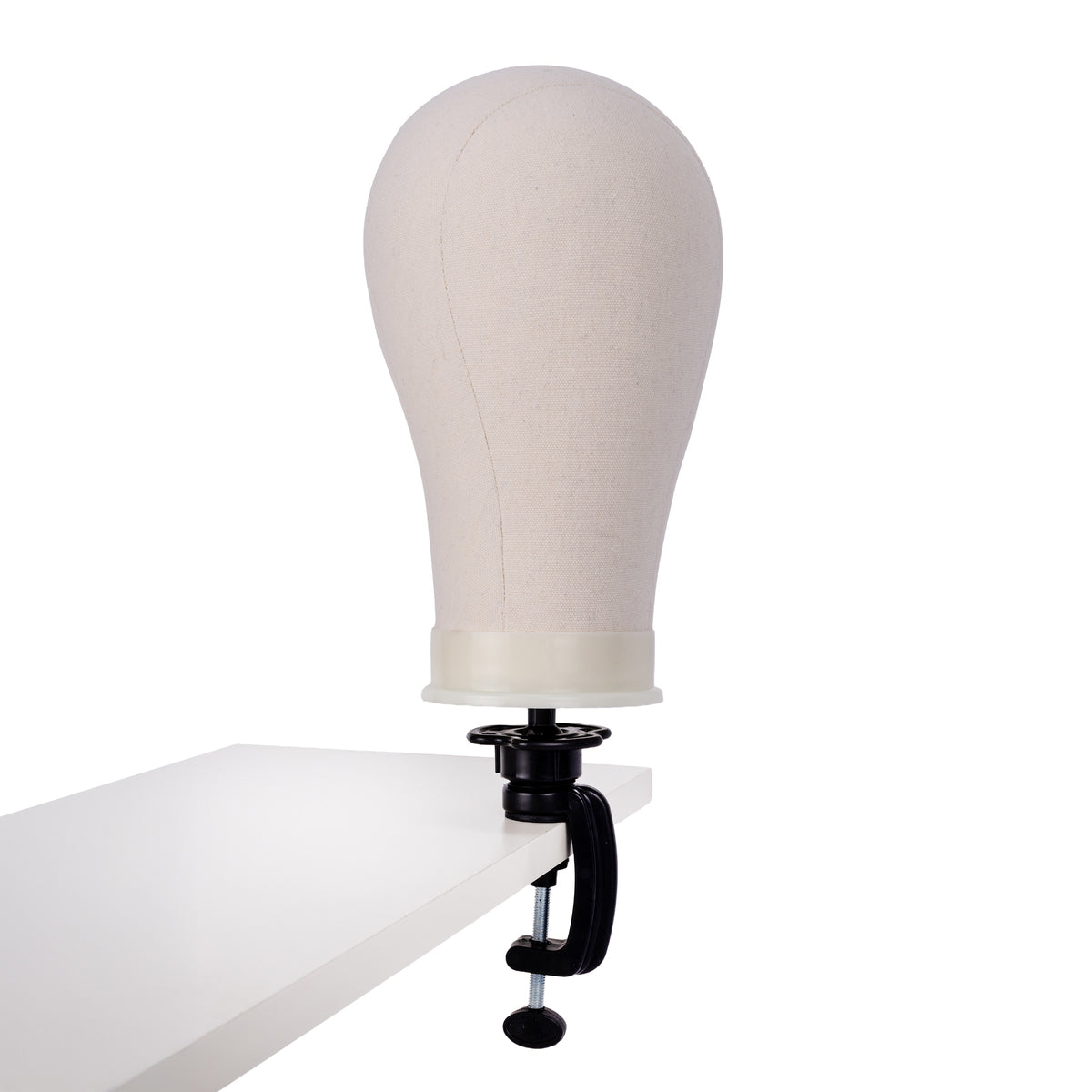 wig & topper starter kit aftercare mannequin head on tabletop for styling and support.